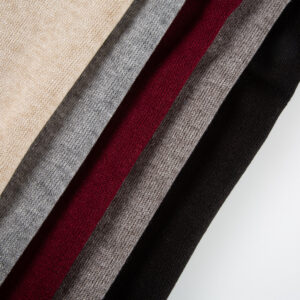 Front-facing shot showing the warm yellow solid color and fine short-pile double-face faux cashmere surface clearly.